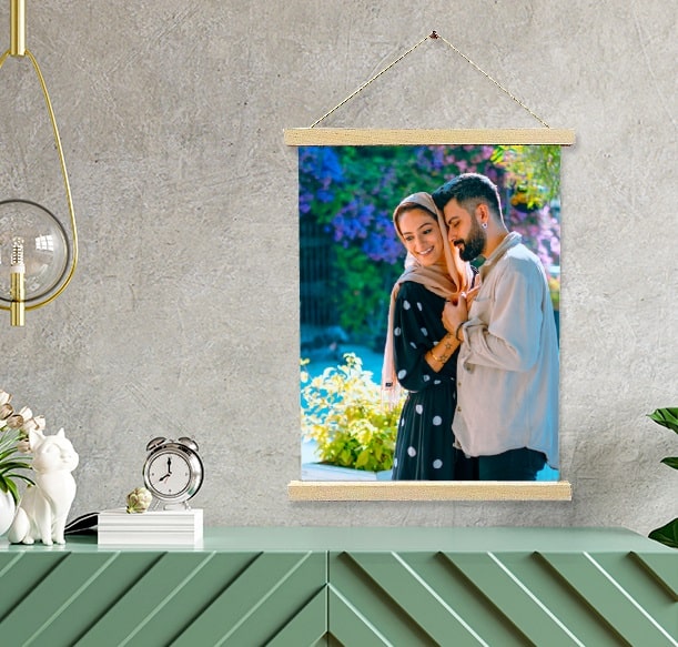 Couple's portrait on canvas in a decorated room setting in Saudi Arabia.