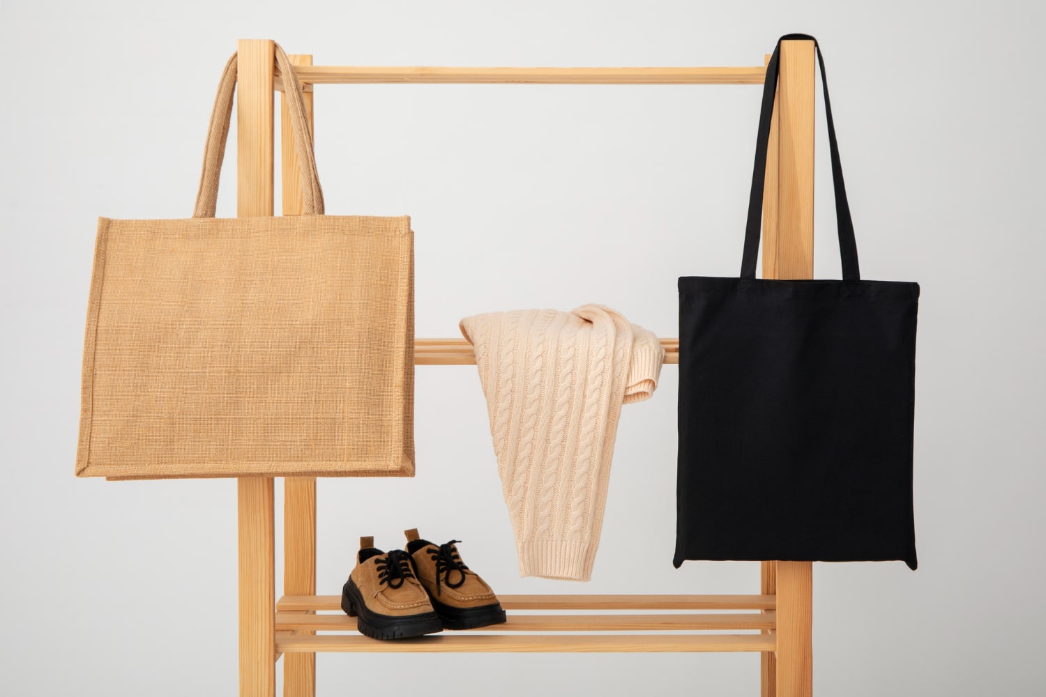 Minimalist tote bags and sweater on rack international women's day gift idea